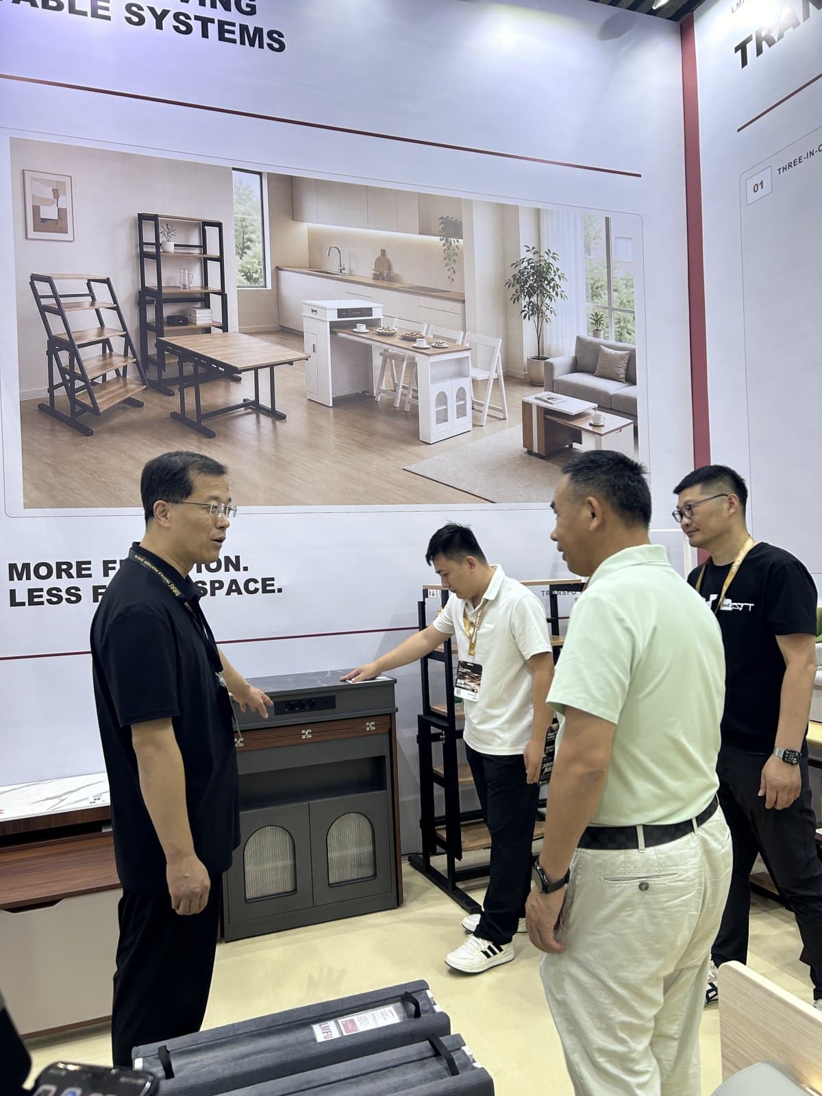 The team presenting furniture to exhibition visitors.