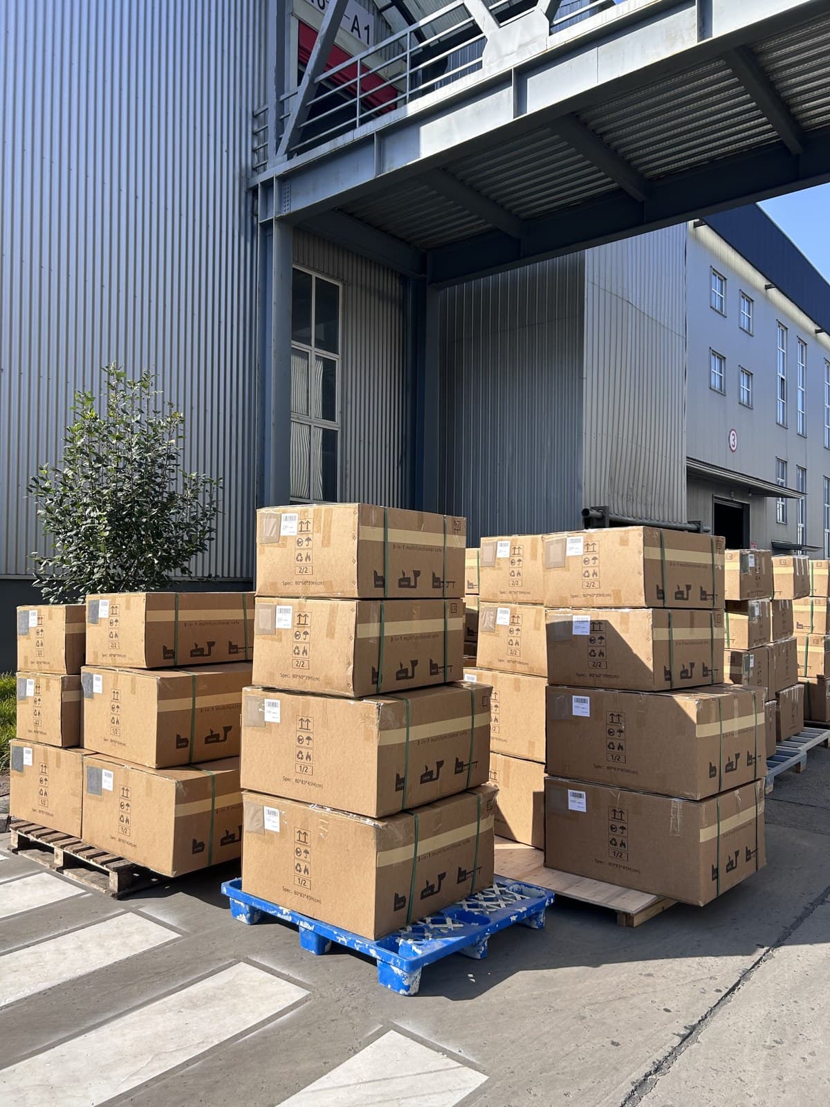 Packaged goods staged outside the workshop.